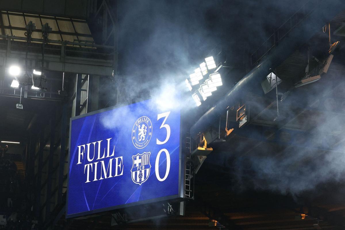 The scoreboard shows the final 3-0 scoreline after the UEFA Champions League league-phase football match between Chelsea and Barcelona at Stamford Bridge in London on November 25, 2025. Chelsea win the game 3-0. (Photo by Adrian Dennis / AFP)