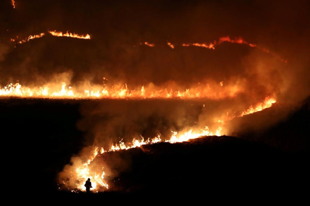 A fire is seen burning on Saddleworth Moor near ...