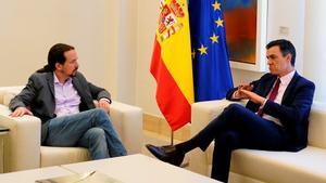 FILE PHOTO: Spain’s acting Prime Minister Pedro Sanchez speaks with Unidas Podemos’ (Together We Can) leader Pablo Iglesias during their meeting at the Moncloa Palace in Madrid, Spain, May 7, 2019. REUTERS/Juan Medina/File Photo