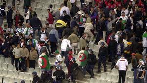 FRENCH RIOT POLICEMEN SURROUND ALGERIAN SUPPORTERS DURING THE SOCCER MATCH BETWEEN FRANCE AND ALGERIA