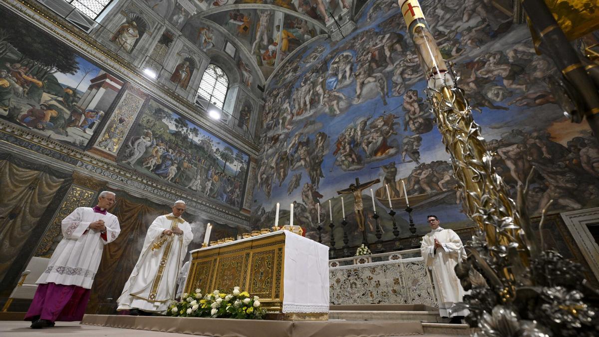 Newly elected Pope Leo XIV, second from left, concelebrates Mass with the College of Cardinals inside the Sistine Chapel at the Vatican the day after his election as 267th pontiff of the Roman Catholic Church, Friday, May 9, 2025. (Vatican Media via AP). AP PROVIDES ACCESS TO THIS GOVERNMENT PRODUCED PHOTO SOLELY TO ILLUSTRATE NEWS REPORTING OR COMMENTARY ON FACTS DEPICTED IN IMAGE; MUST BE USED WITHIN 14 DAYS FROM TRANSMISSION; NO ARCHIVING; NO LICENSING; MANDATORY CREDIT