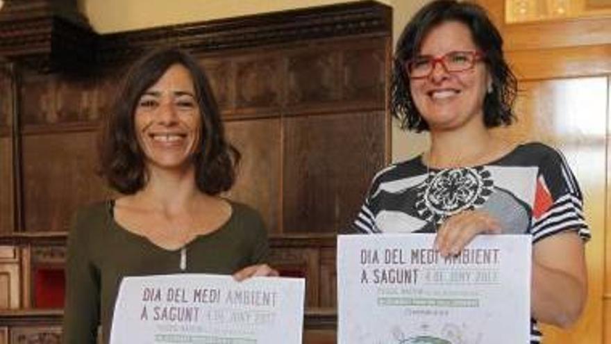 Aunés y Garcia, con los carteles de la feria.