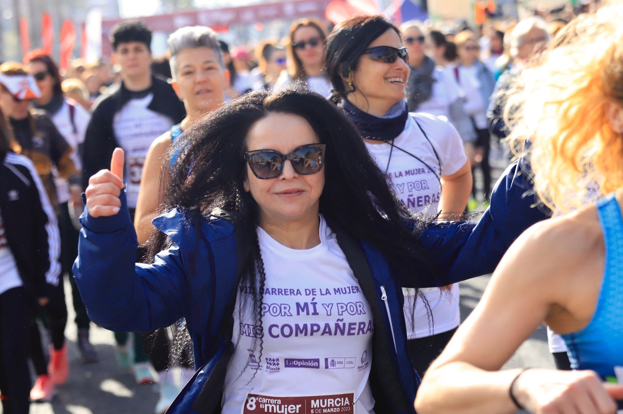 La salida y el recorrido de la Carrera de la Mujer 'inmortalizados' en imágenes