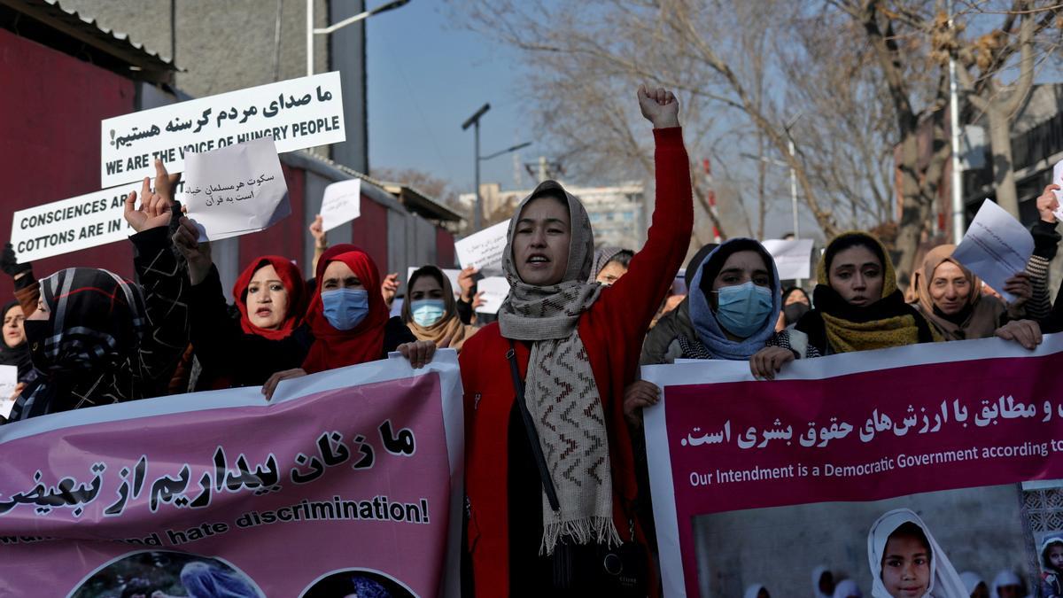 FILE PHOTO: Afghan women shout slogans during a rally to protest against what the protesters say is Taliban restrictions on women, in Kabul