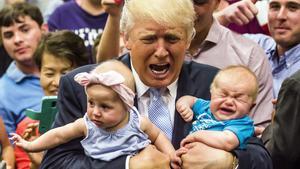 Republican presidential candidate Donald Trump holds baby cousins Evelyn Kate Keane, 6 months old, and Kellen Campbell, 3 months old, following his speech Friday, July 29, 2016, in Colorado Springs, Colo. (Stacie Scott/The Gazette via AP)