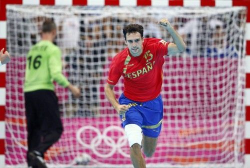Spain's Cristian Ugalde Garcia celebrates a goal in their men's handball quarterfinals match against France at the Basketball Arena during the London 2012 Olympic Games