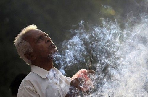 A Buddhist devotee worships on Vesak day at Kelaniya temple in Colombo