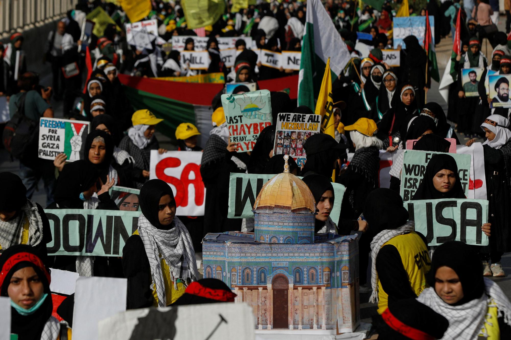 People attend a rally marking al-Quds Day, (Jerusalem Day), in Karachi