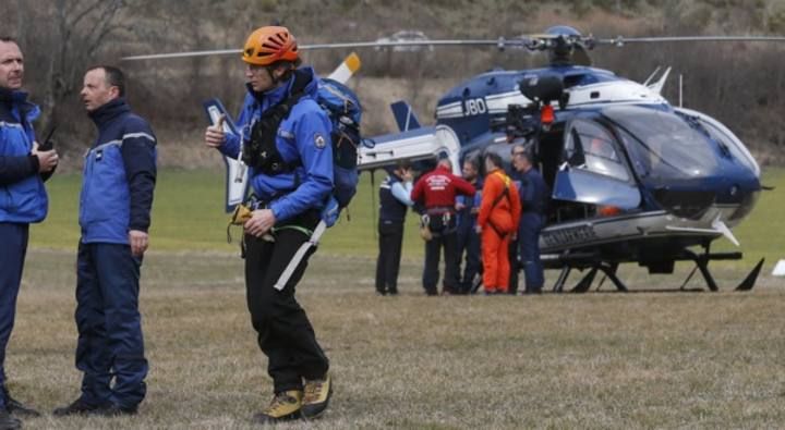 French Alpine rescue units gather on a field as they prepare to reach the crash site of an Airbus A320