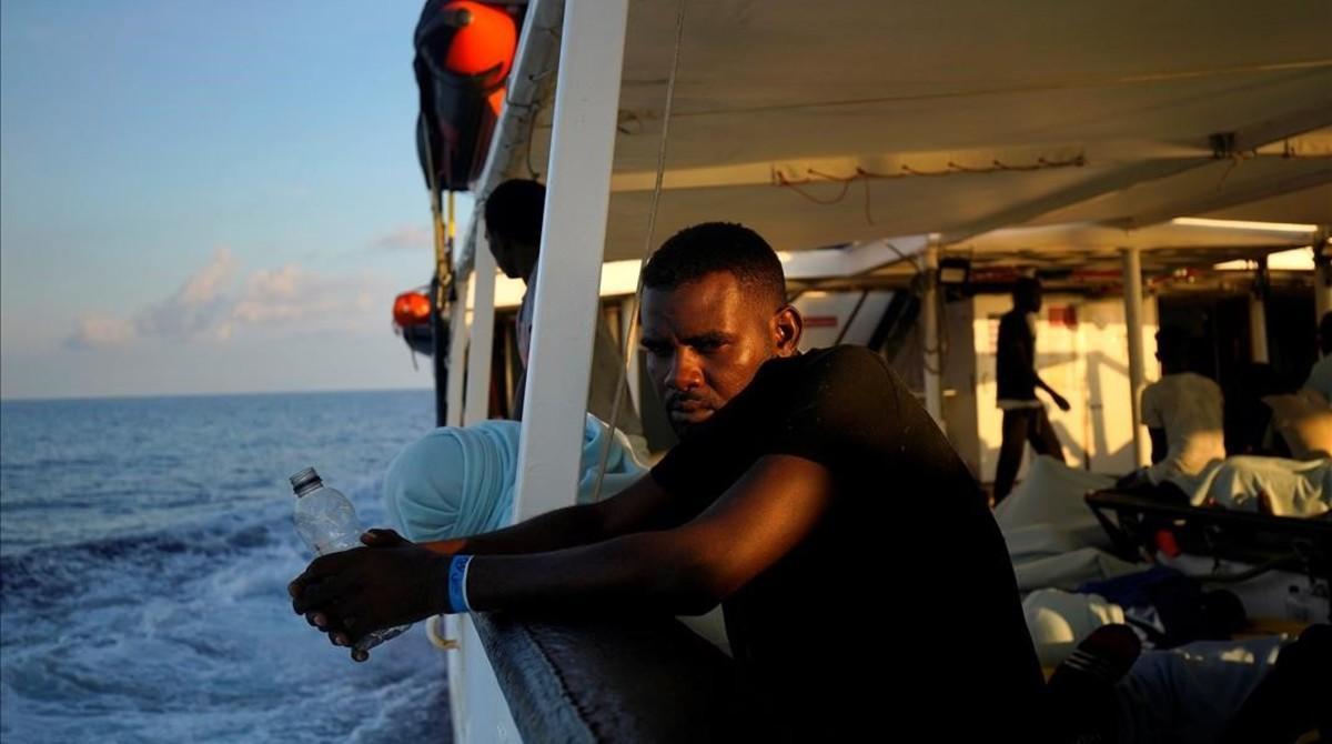 zentauroepp44561388 a migrant sits on board ngo proactiva open arms rescue boat 180806121457