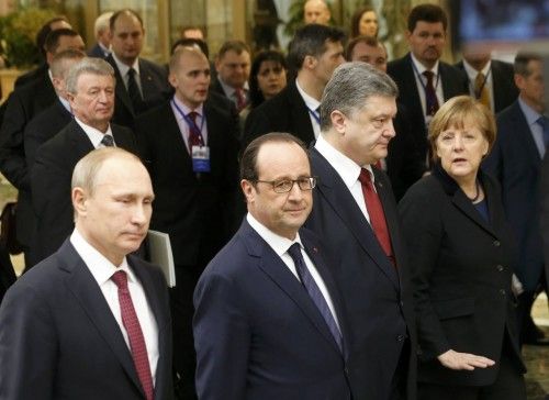 Russia's President Putin, Ukraine's President Poroshenko, Germany's Chancellor Merkel and France's President Hollande walk during peace talks in Minsk