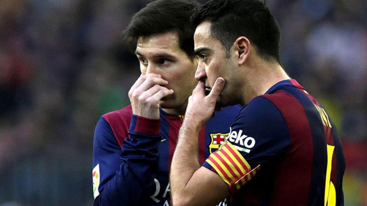 Leo Messi y Xavi Hernández durante un partido del FC Barcelona en la temporada 2014-15