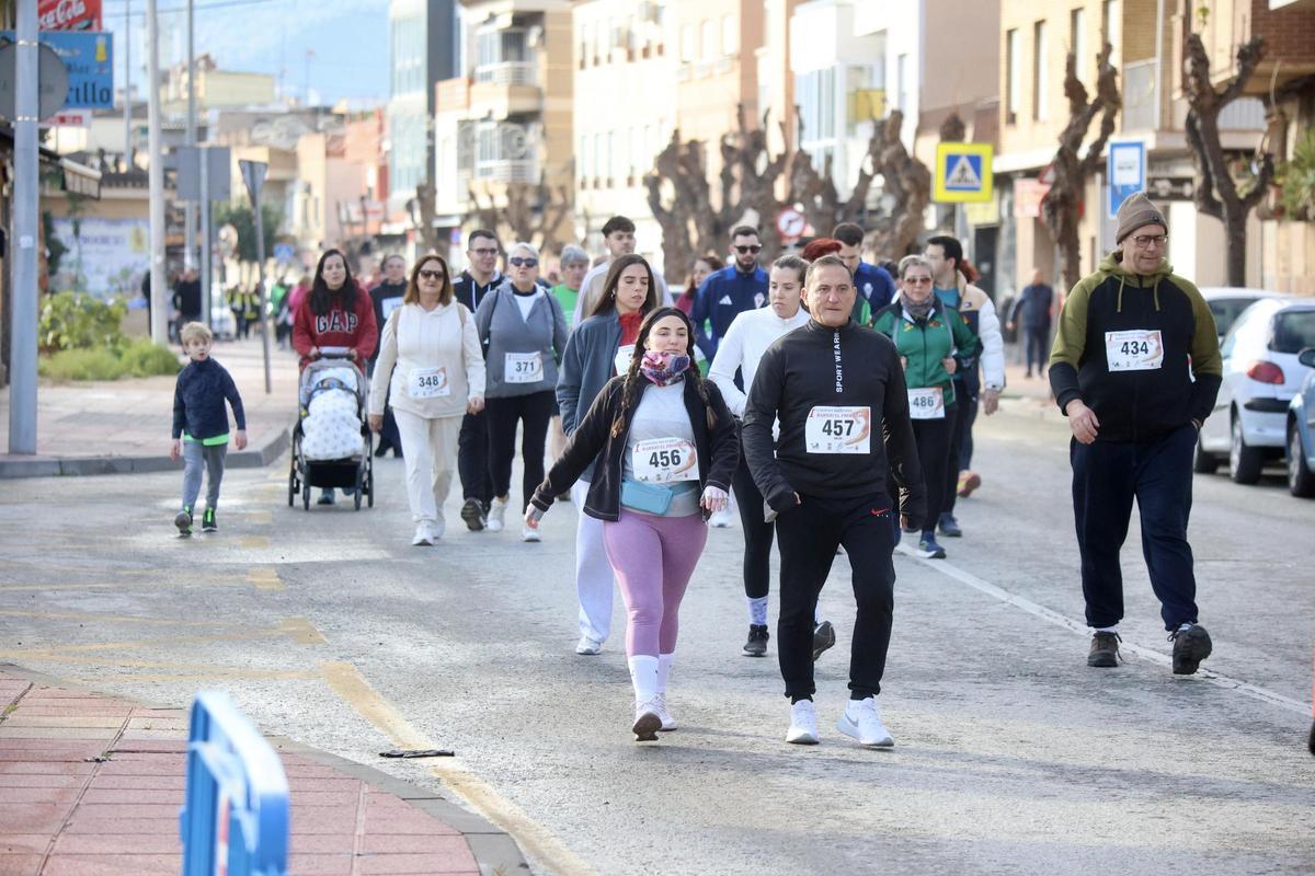 Las imágenes de la carrera popular solidaria en el barrio de El Progreso