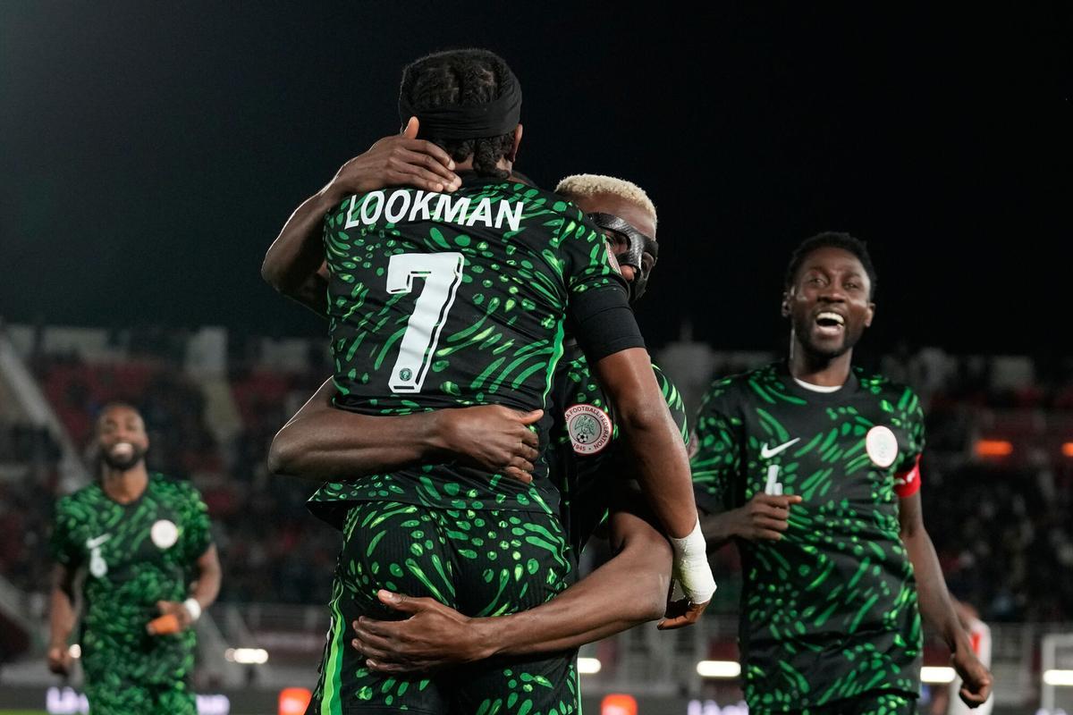 Nigeria's Victor Osimhen, center, celebrates with Nigeria's Ademola Lookman, front, after scoring his side's third goal during the Africa Cup of Nations round of 16 soccer match between Nigeria and Mozambique in Fez, Morocco, Monday, Jan. 5, 2026. (AP Photo/Themba Hadebe) Associated Press / LaPresse Only italy and spain