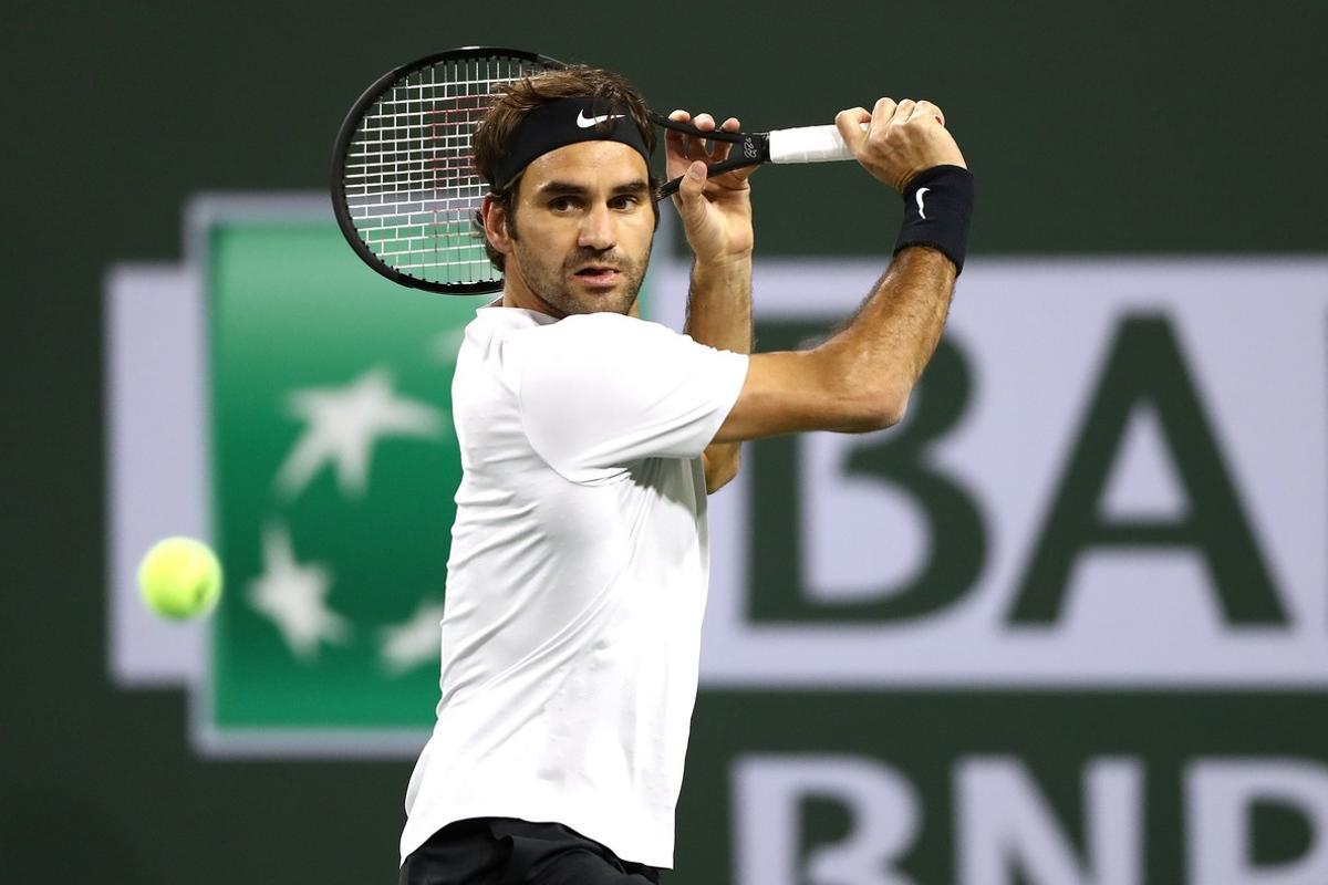 INDIAN WELLS, CA - MARCH 15: Roger Federer of Switzerland returns a shot to Hyeon Chung of Korea during of the BNP Paribas Open at the Indian Wells Tennis Garden on March 15, 2018 in Indian Wells, California.   Matthew Stockman/Getty Images/AFP