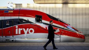 Archivo - Una persona camina en el andén de la estación Joaquín Sorolla tras la llegada de un tren Iryo