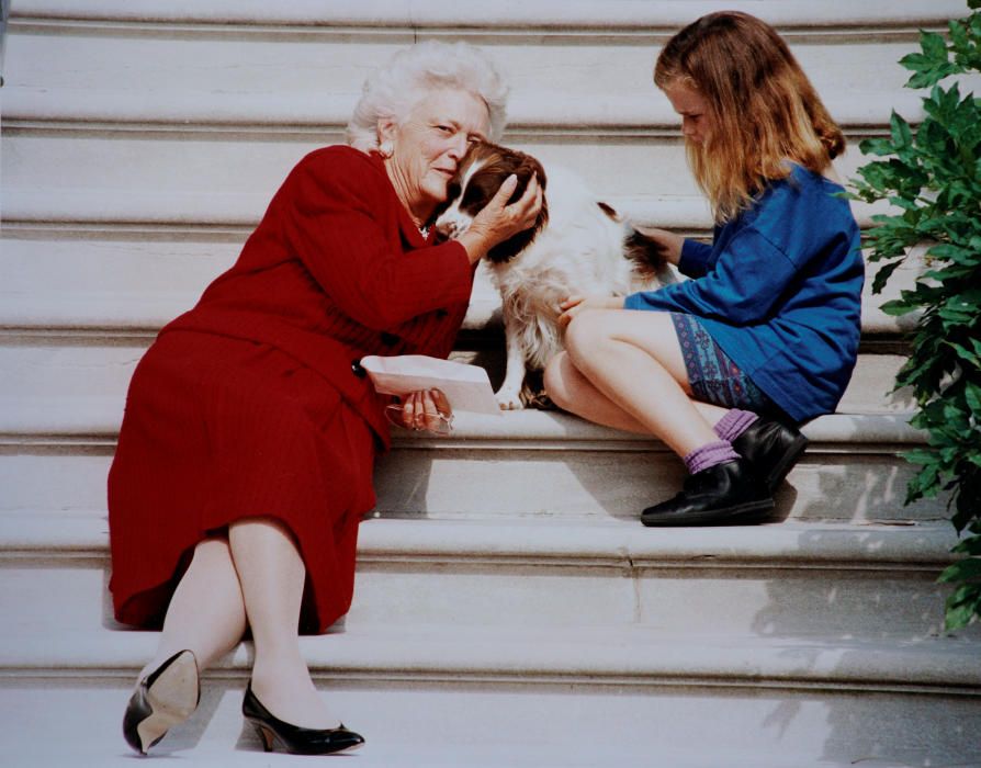 U.S. first lady Barbara Bush pets her dog Millie ...