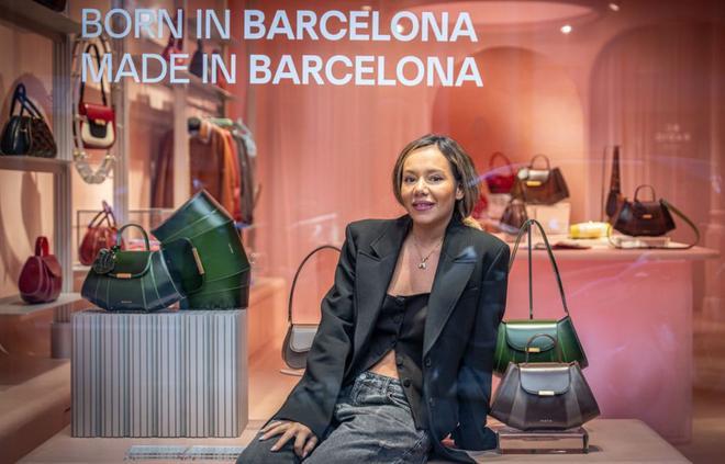 Comprar-se una bossa de mà, "símbol de poder"