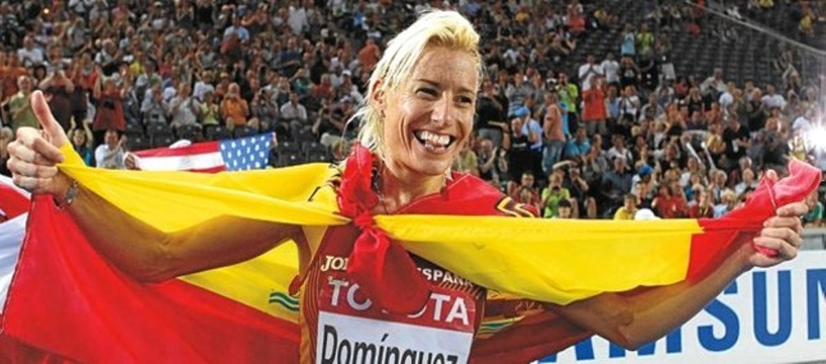 Marta Dominguez of Spain celebrates after winning in the women’s 3000 meters steeplechase final during the world athletics championships at the Olympic stadium in Berlin, August 17, 2009. REUTERS/Dominic Ebenbichler (GERMANY SPORT ATHLETICS)