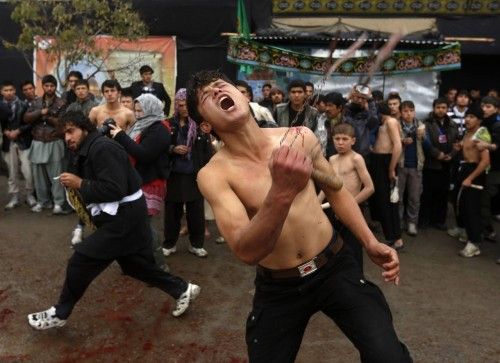 Afghan Shi'ite Muslim flagellates himself during an Ashoura procession in Kabul