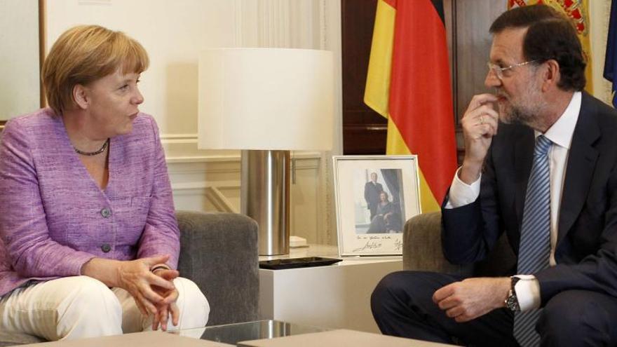Rajoy y Merkel durante un encuentro en 2012.