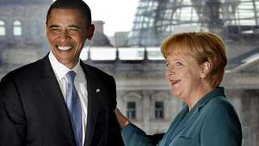 Obama empieza la etapa europea de su gira con una reunión con Merkel