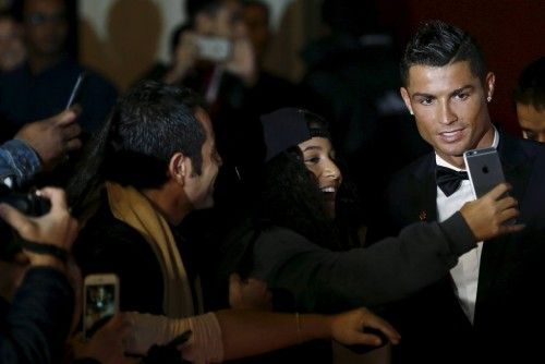 Soccer player Ronaldo poses for photograph on the red carpet at the world premiere of "Ronaldo" at Leicester Square in London