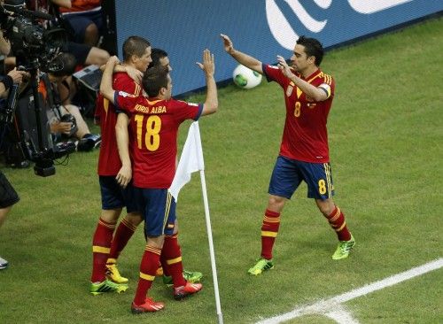Spain's players celebrate after their teammate Torres scored a goal during their Confederations Cup Group B soccer match against Nigeria at the Estadio Castelao in Fortaleza