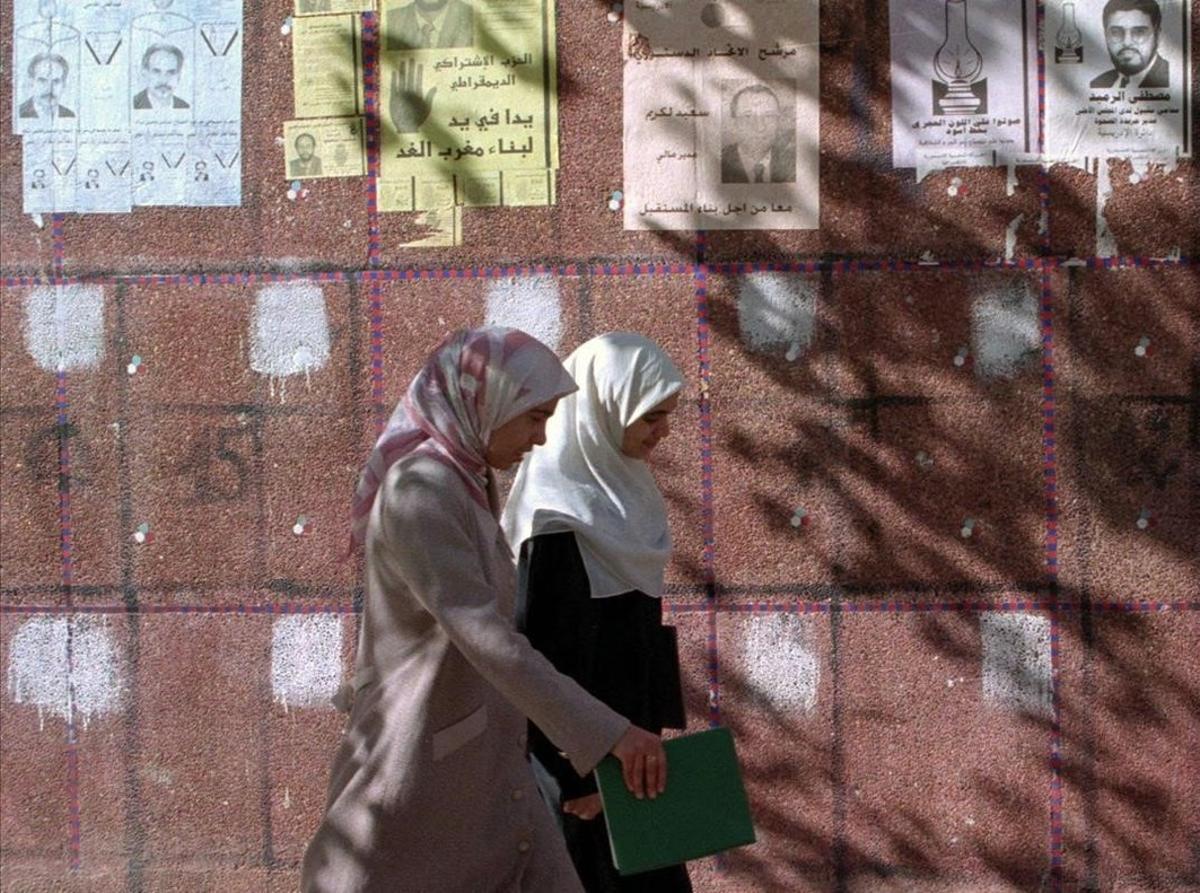 undefined379168 ap  moroccan women walk past election posters in casablanca 180913103048