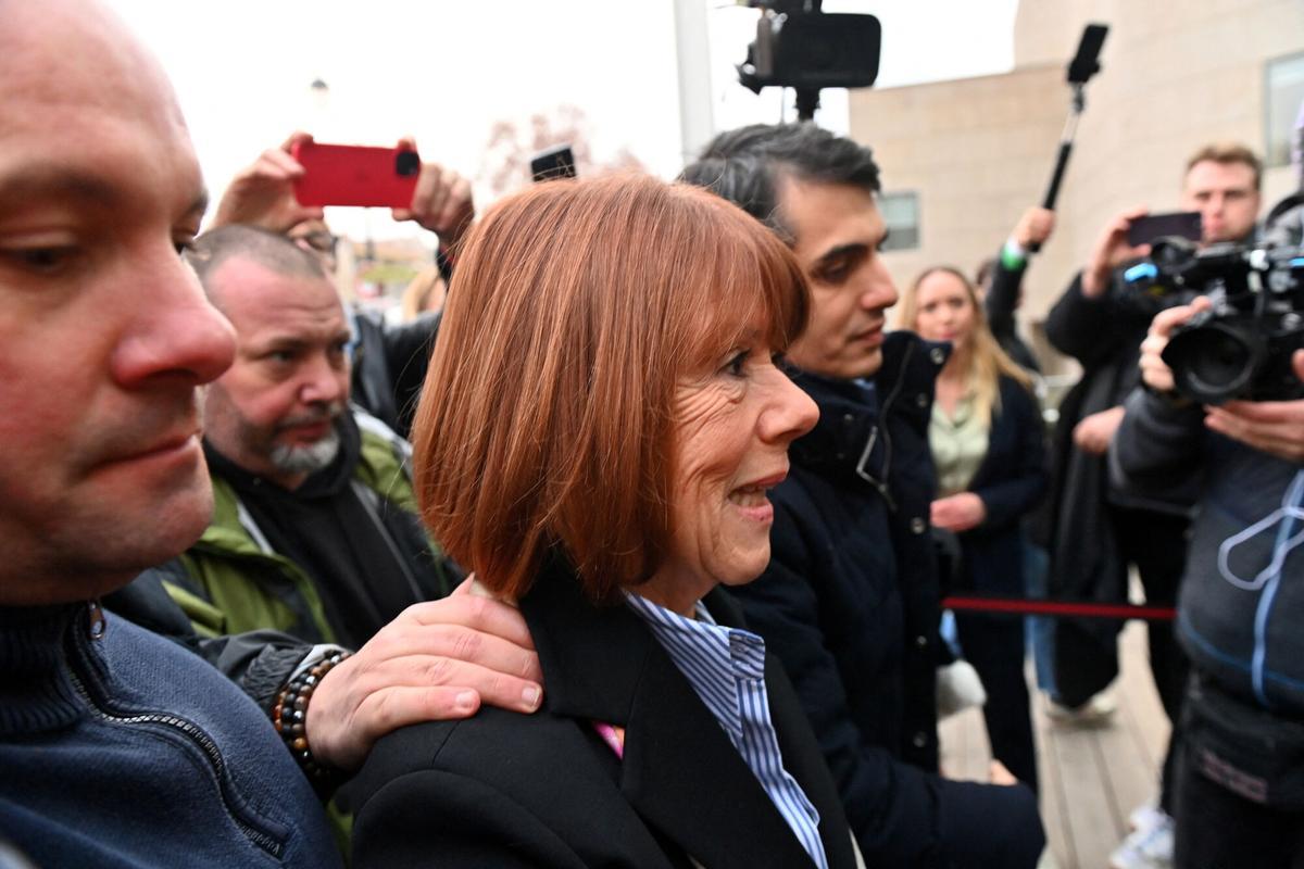 Frenchwoman Gisele Pelicot, the victim of an alleged mass rape orchestrated by her then-husband Dominique Pelicot at their home in the southern French town of Mazan, arrives with her lawyer Stephane Babonneau to attend the verdict in the trial for Dominique Pelicot and 50 co-accused, at the courthouse in Avignon, France, December 19, 2024. REUTERS/Alexandre Dimou