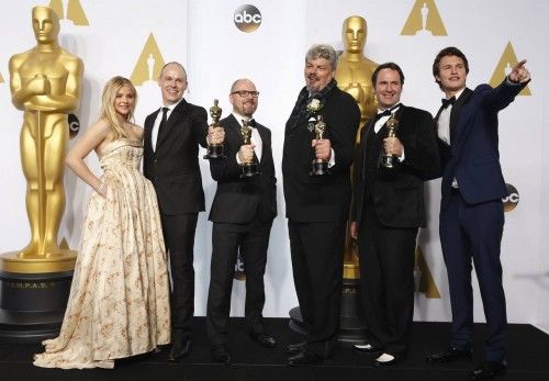 Winners of the award for best visual effects for the movie "Interstellar" Franklin, Lockey, Hunter, and Fisher pose with presenters Elgort and Grace Moretz during the 87th Academy Awards in Hollywood