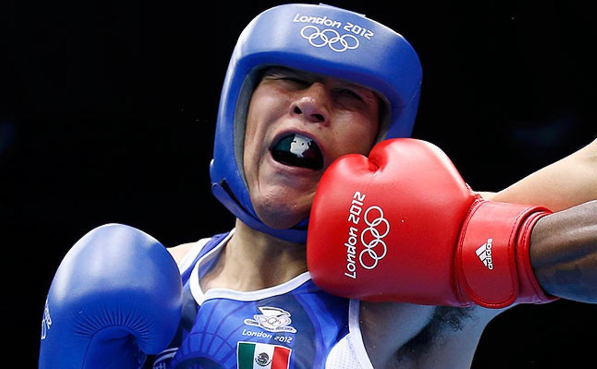 El boxejador Custio Clayton del Canadà elimina dels Jocs el mexicà Oscar Molina, medallista panamericà, en la categoria wèlter.