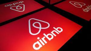 (FILES) In this file illustration photo taken on November 22  2019 shows the logo of the online lodging service Airbnb displayed on a tablet in Paris  - Home-sharing giant Airbnb  which is scheduled to go public this week  will significantly raise its IPO price  valuing the group at more than  40 billion  the Wall Street Journal reported on December 6  2020  (Photo by Lionel BONAVENTURE   AFP)