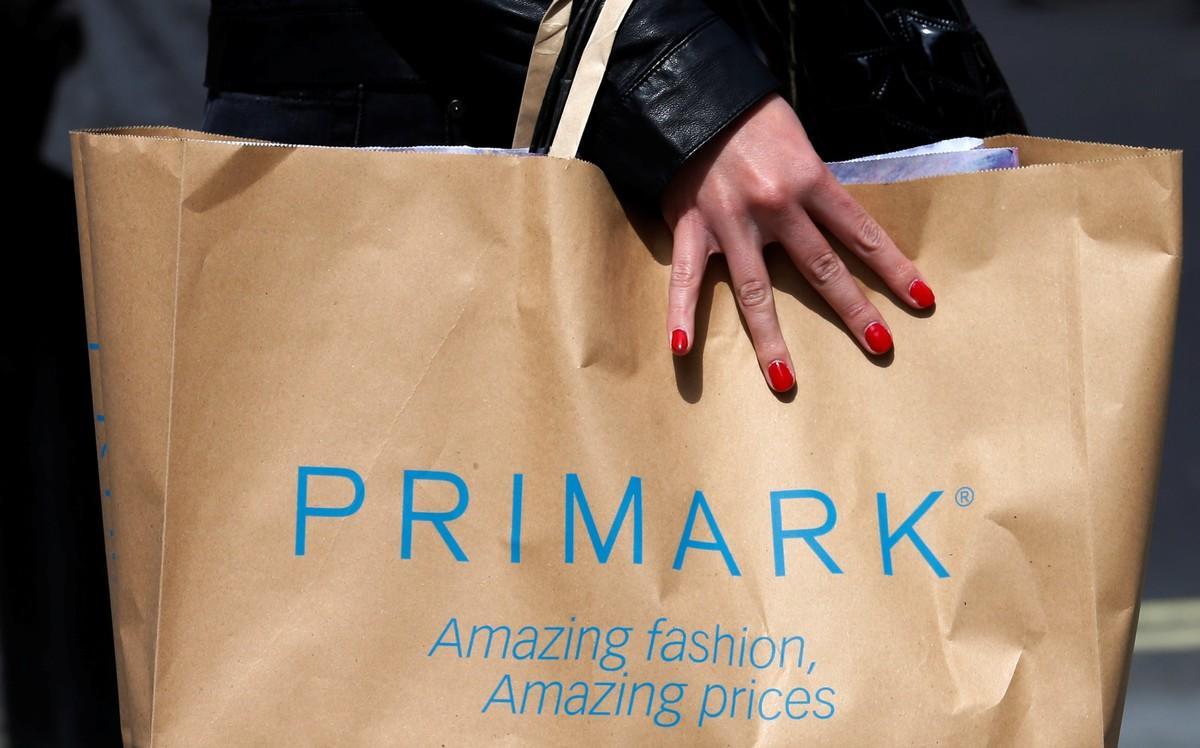 FILE PHOTO  A shopper walks past a branch of clothing retailer Primark in London  Britain April 27  2013   REUTERS Suzanne Plunkett File Photo