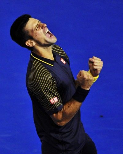 Novak Djokovic of Serbia celebrates defeating Andy Murray of Britain in their men's singles final match at the Australian Open tennis tournament in Melbourne