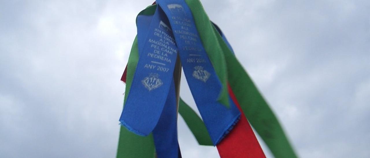 Cinta verde magdalenera, la azul característica del Grau y la roja, de Sant Roc de la Donació, en imagen de archivo.