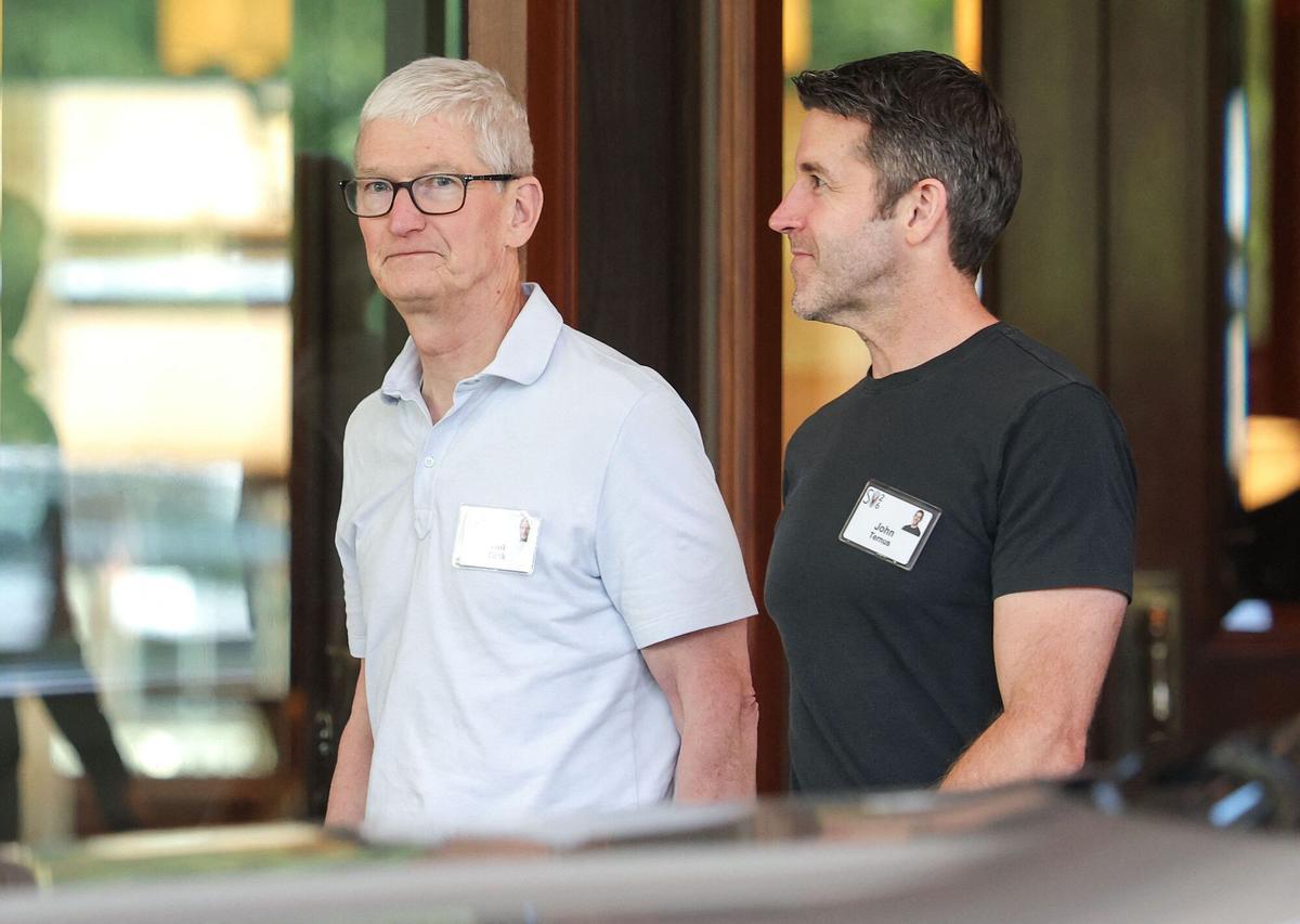 (FILES) Tim Cook (L), CEO of Apple, walks with John Ternus, incoming CEO of Apple, at the Allen &amp;amp; Company Sun Valley Conference at the Sun Valley Lodge on July 7, 2026 in Sun Valley, Idaho. Apple's chief executive Tim Cook hands over the company's reins to it's vice president of hardware engineering John Ternus on September 1, 2026. Cook spent nearly three decades at Apple, which he has led as CEO since 2011. (Photo by Kevin Dietsch / GETTY IMAGES NORTH AMERICA / AFP)