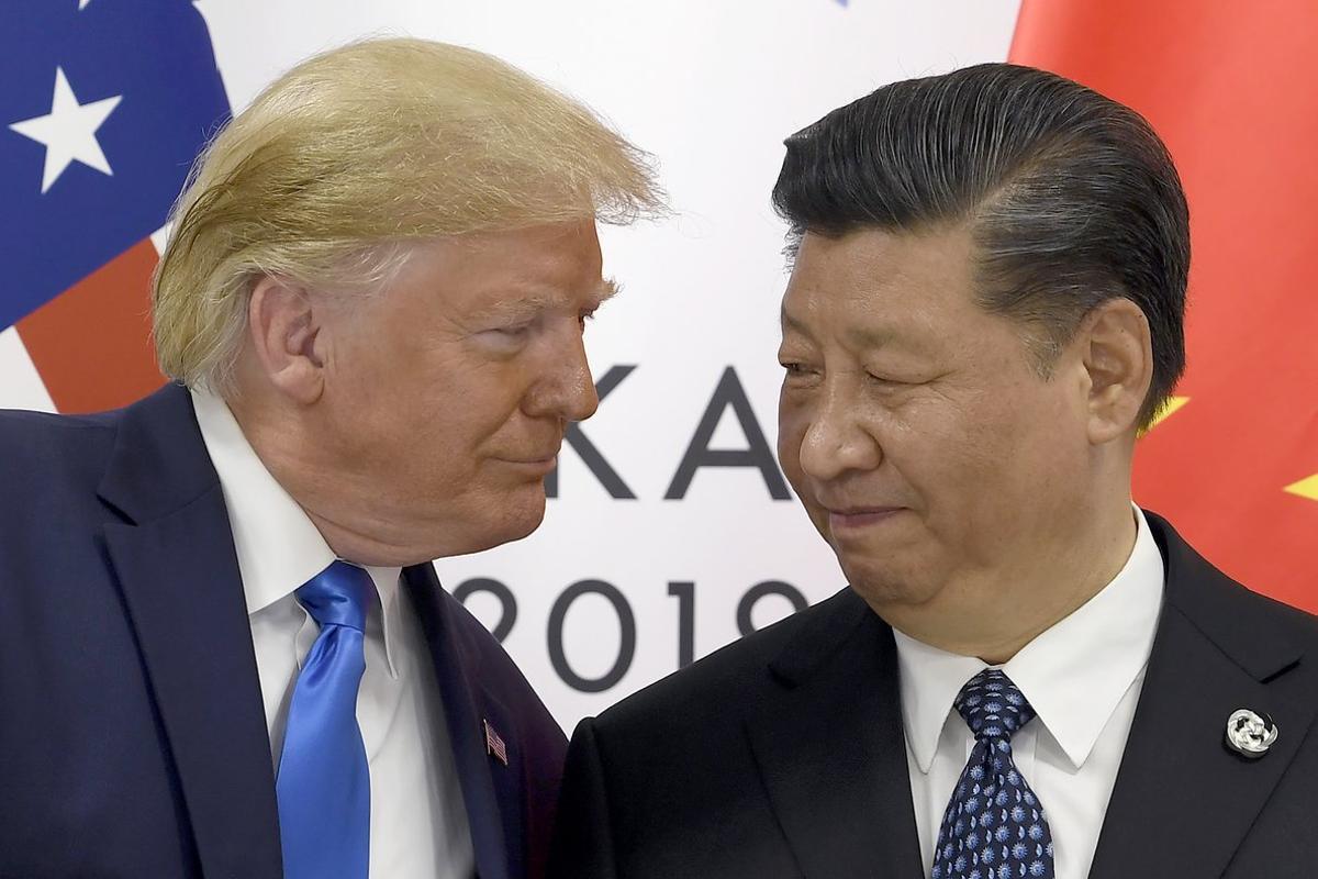 FILE - In this June 29, 2019, file photo, President Donald Trump, left, meets with Chinese President Xi Jinping during a meeting on the sidelines of the G-20 summit in Osaka, Japan. China has announced it will raise tariffs on $75 billion of U.S. products in retaliation for President Donald Trump’s planned Sept. 1 duty increase in a war over trade and technology policy. (AP Photo/Susan Walsh, File)