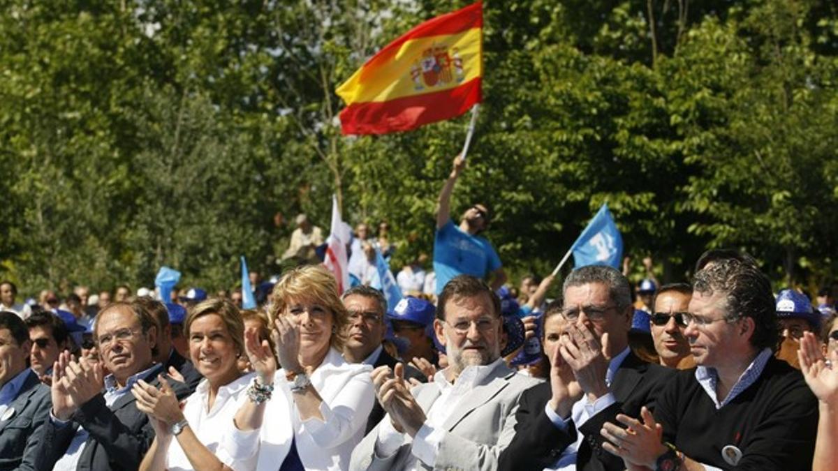 Esperanza Aguirre, Mariano Rajoy y Alberto Ruiz Gallardón, hoy en Madrid.