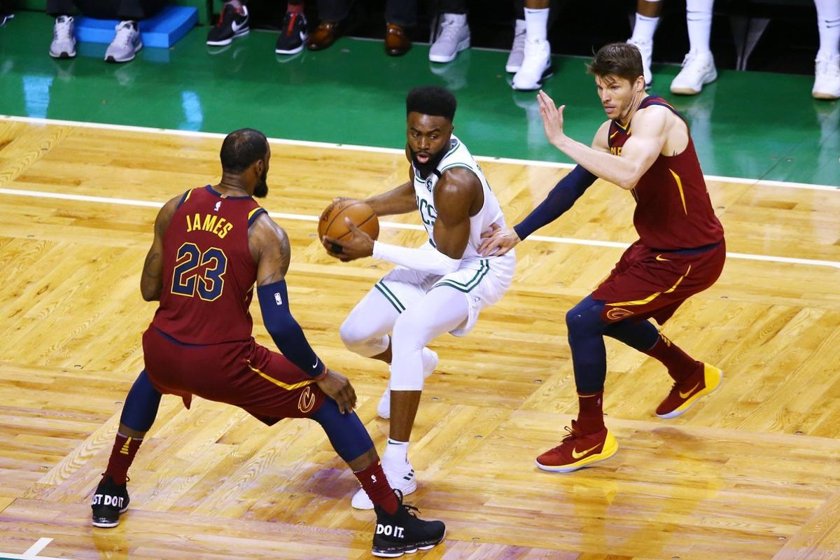 BOSTON, MA - MAY 13: Jaylen Brown #7 of the Boston Celtics is defended by LeBron James #23 and Kyle Korver #26 of the Cleveland Cavaliers during the first quarter in Game One of the Eastern Conference Finals of the 2018 NBA Playoffs at TD Garden on May 13, 2018 in Boston, Massachusetts.   Adam Glanzman/Getty Images/AFP