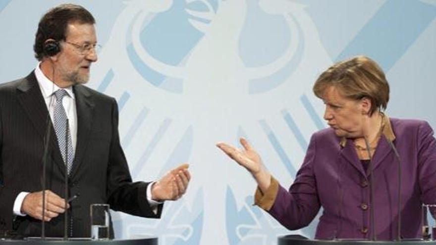 Rajoy y Merkel, en una cumbre conjunta el año pasado.