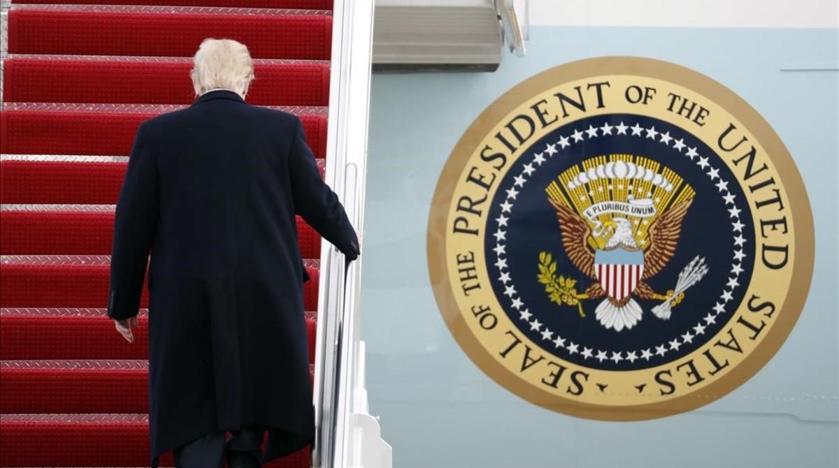 undefined37156735 president donald trump walks up the steps of air force one a170203214216