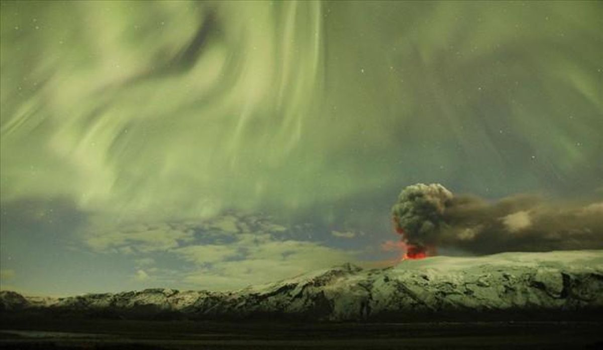 The Northern Lights are seen above the ash plume of Iceland’s Eyjafjallajokull volcano in the evening in this April 22, 2010 file photo.