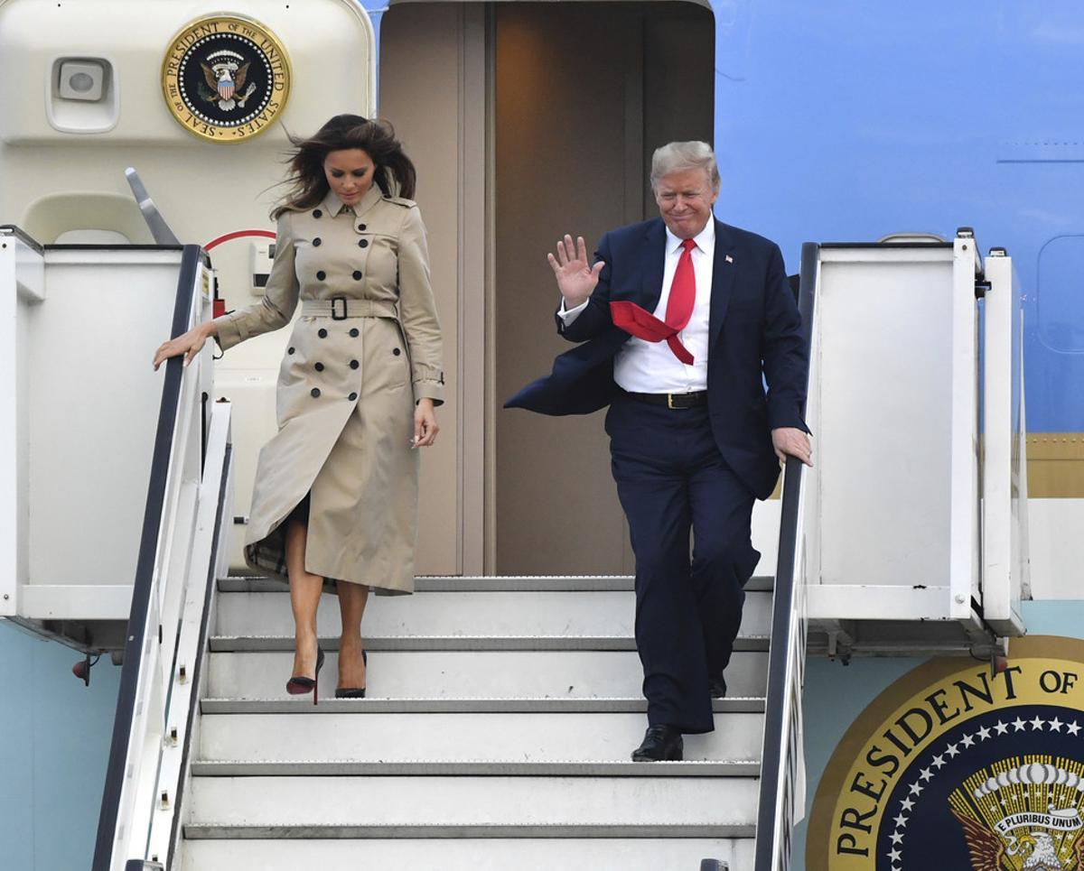 U.S. President Donald Trump and First Lady Melania Trump disembark Air Force One as they arrive at Melsbroek Military airport in Melsbroek, Belgium, Tuesday, July 10, 2018. U.S. President Donald Trump is in Brussels to attend a two-day NATO summit. (AP Photo/Geert Vanden Wijngaert)