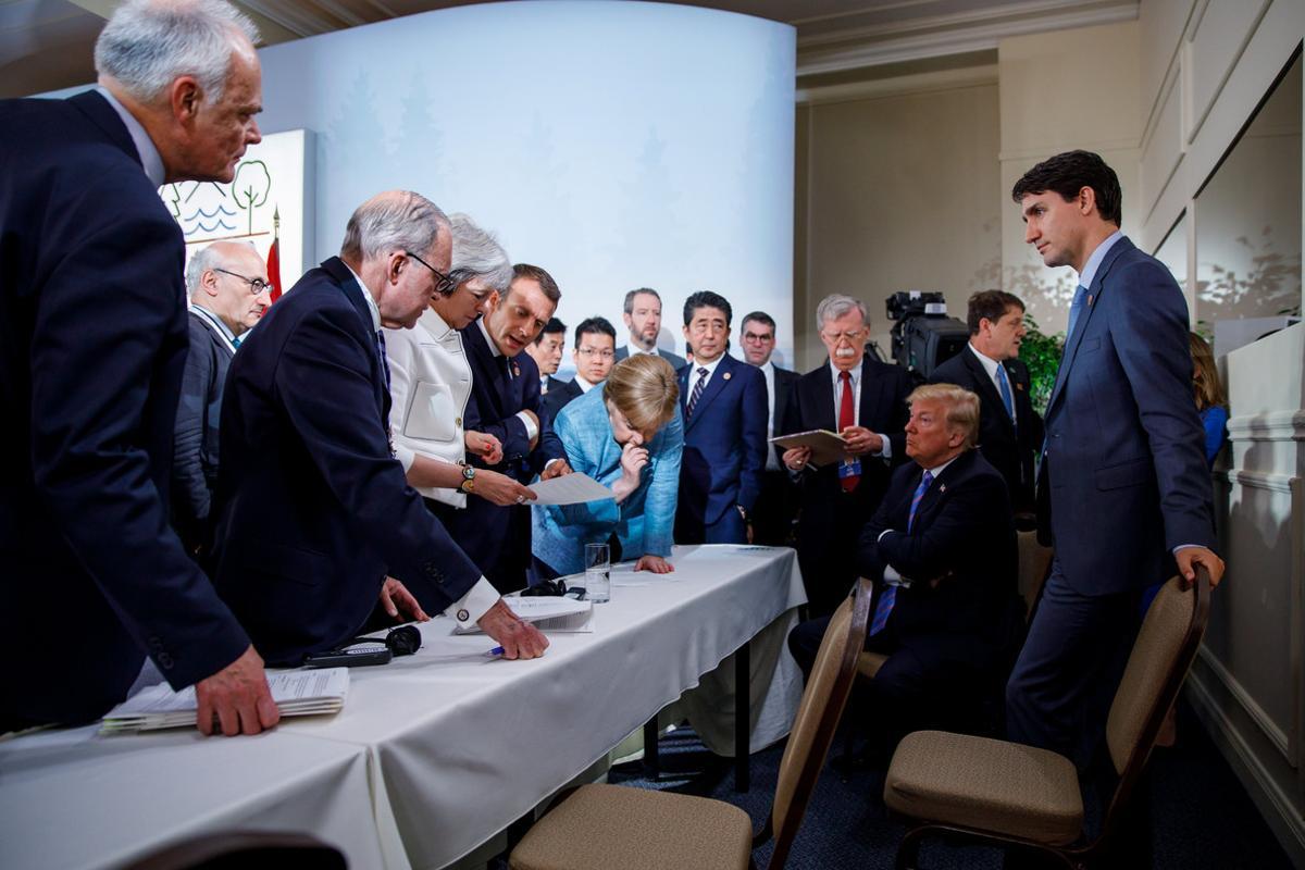 Canada’s Prime Minister Justin Trudeau and G7 leaders Britain’s Prime Minister Theresa May, France’s President Emmanuel Macron, Germany’s Chancellor Angela Merkel, Japan’s Prime Minister Shinzo Abe and U.S. President Donald Trump discuss the joint statement following a breakfast meeting on the second day of the G7 meeting in Charlevoix city of La Malbaie, Quebec, Canada, June 9, 2018.  Adam Scotti/Prime Minister’s Office/Handout via REUTERS. ATTENTION EDITORS - THIS IMAGE WAS PROVIDED BY A THIRD PARTY.