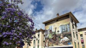 Mural en la Barriada de Murillo del Polígono Sur, donde se encuentra la asociación vecinal Esparanza Sur
