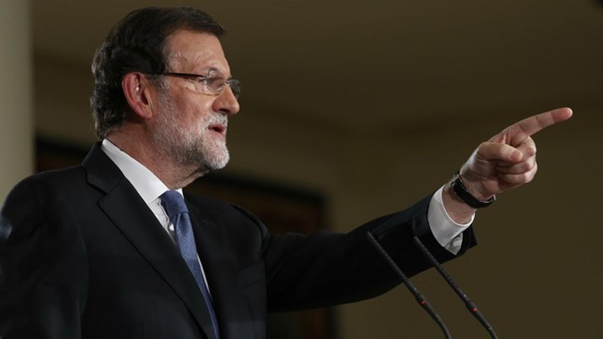 El presidente del Gobierno, Mariano Rajoy, durante la rueda de prensa tras el último Consejo de Ministros del año, en la que ha hecho balance del 2014.