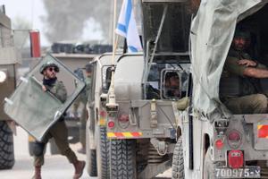 Israeli forces move along the central Gaza border