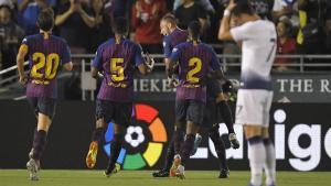 Barcelona midfielder Arthur, center, celebrates his goal with teammates midfielder Sergi Roberto, left, midfielder Marlon Santos, second from left, and defender Nelson Semedo, second from right, as Tottenham forward Son Heung-Min wipes his head during the first half of an International Champions Cup tournament soccer match Saturday, July 28, 2018, in Pasadena, Calif. (AP Photo/Mark J. Terrill)