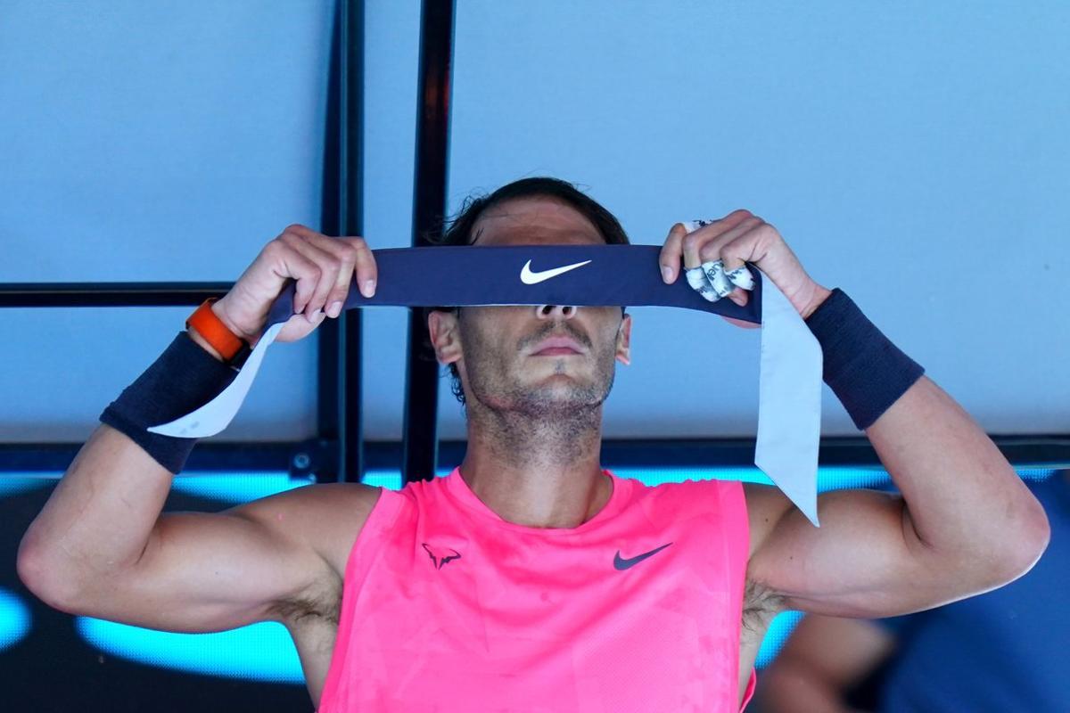 Rafael Nadal of Spain rests during his third round match against Pablo Carreno Busta of Spain on day six of the Australian Open tennis tournament at Rod Laver Arena in Melbourne, Saturday, January 25, 2020. (AAP Image/Scott Barbour) NO ARCHIVING, EDITORIAL USE ONLY